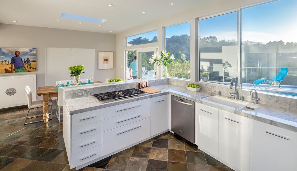 Delta Single Handle Kitchen Faucet Contemporary Kitchen with White Dining Chairs