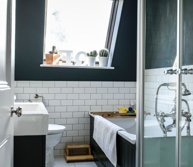 Do It Yourself Concrete Leveling Transitional Bathroom with Sloped Ceiling