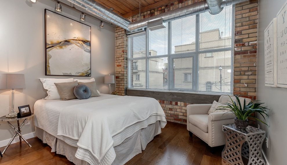 Exposed Air Conditioning Ducts Industrial Bedroom with Blinds
