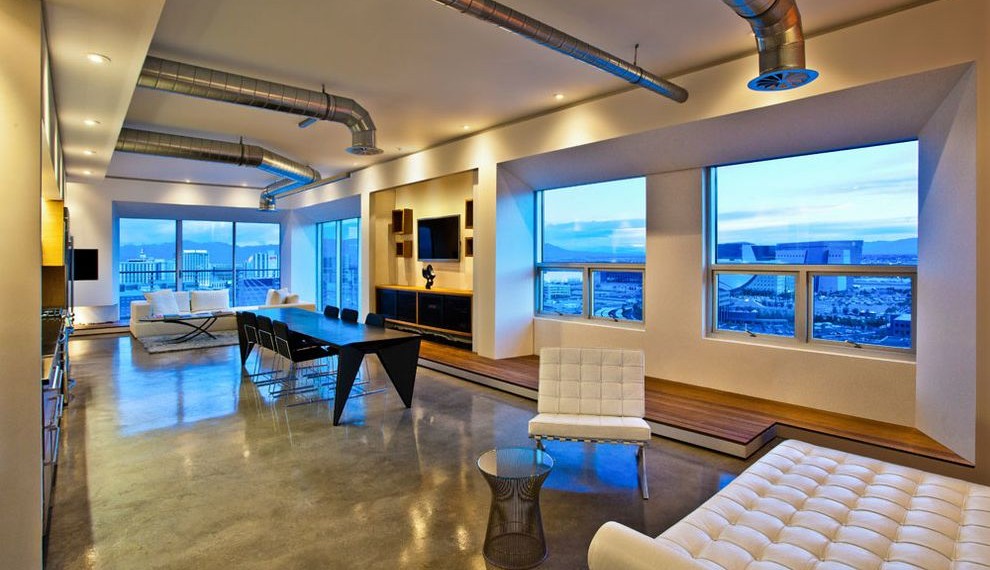 Exposed Air Conditioning Ducts Industrial Living Room with Dining Table