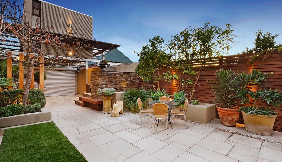 Flagstone Pavers Contemporary Patio with Decorative Timber Fencing