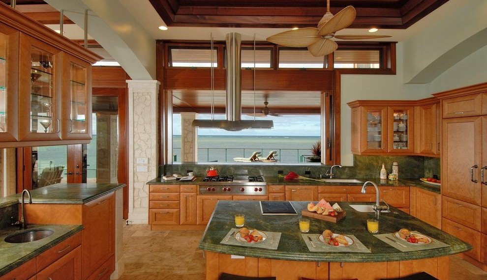 Gable Vent Fan Beach Style Kitchen with Glass Front Cabinets