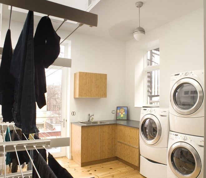 Indoor Firewood Rack Contemporary Laundry Room with Front Loading Washer and Dryer