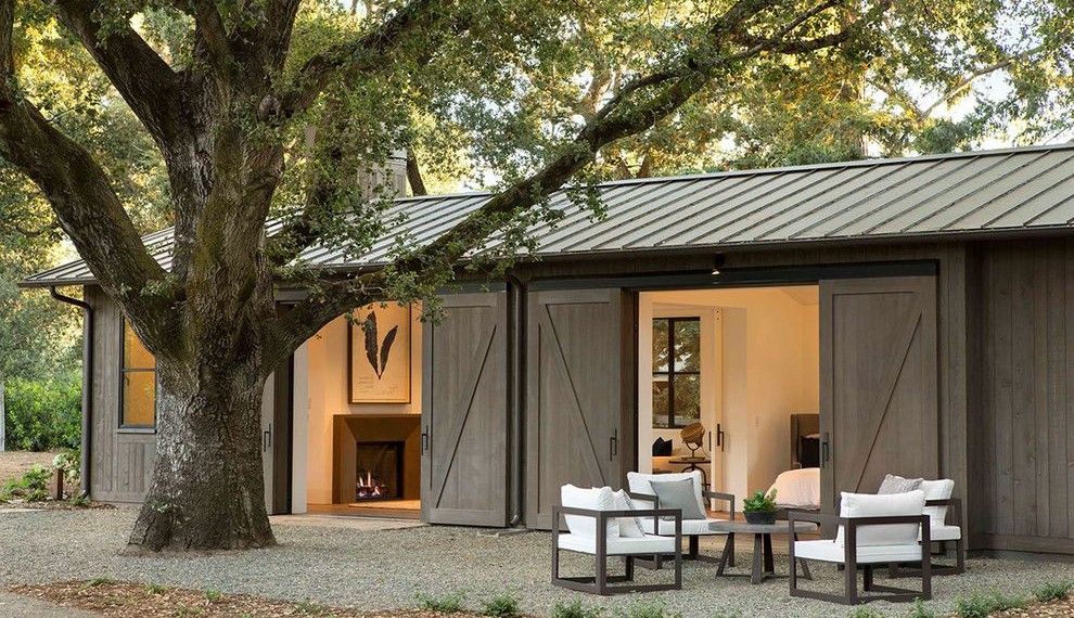 Inside Sliding Barn Doors Farmhouse Exterior with Standing Seam Roof