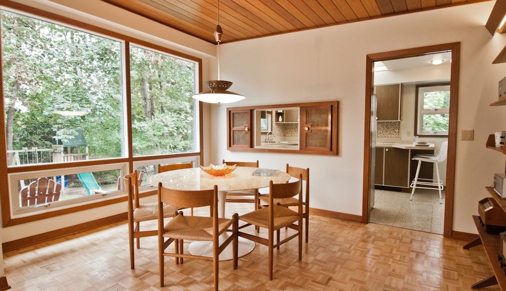 Parkay Floors Midcentury Dining Room with Built in Bookcase