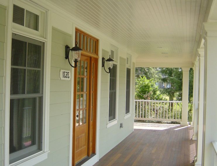 Tongue and Groove Decking Eclectic Porch with White Trim
